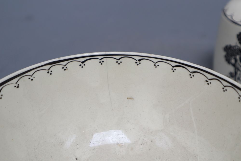 A late 18th century black transfer printed creamware bowl, diameter 14.5cm and two caddies with one cover